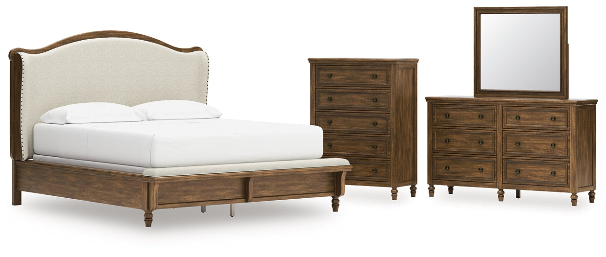Sturlayne California King Upholstered Panel Bed with Mirrored Dresser and Chest